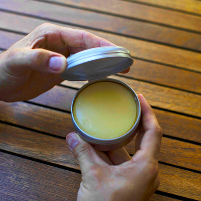 Open tin of the Naked Armor Noah's Organic Shaving Soap