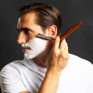 Man shaving with the Naked Armor Thor Straight Razor 7/8" Redwood Japanese Stainless Steel