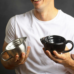 Man holding the Naked Armor Savanna Scuttle and Silver Fox Scuttle