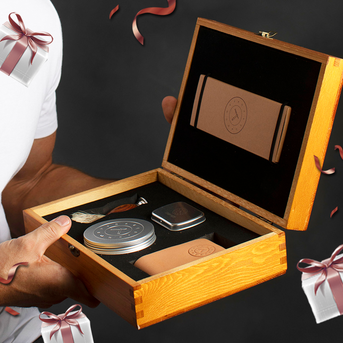 A man holding the Naked Armor Solomon Straight Razor Kit surrounded by Mother's Day themed gift boxes and confetti.