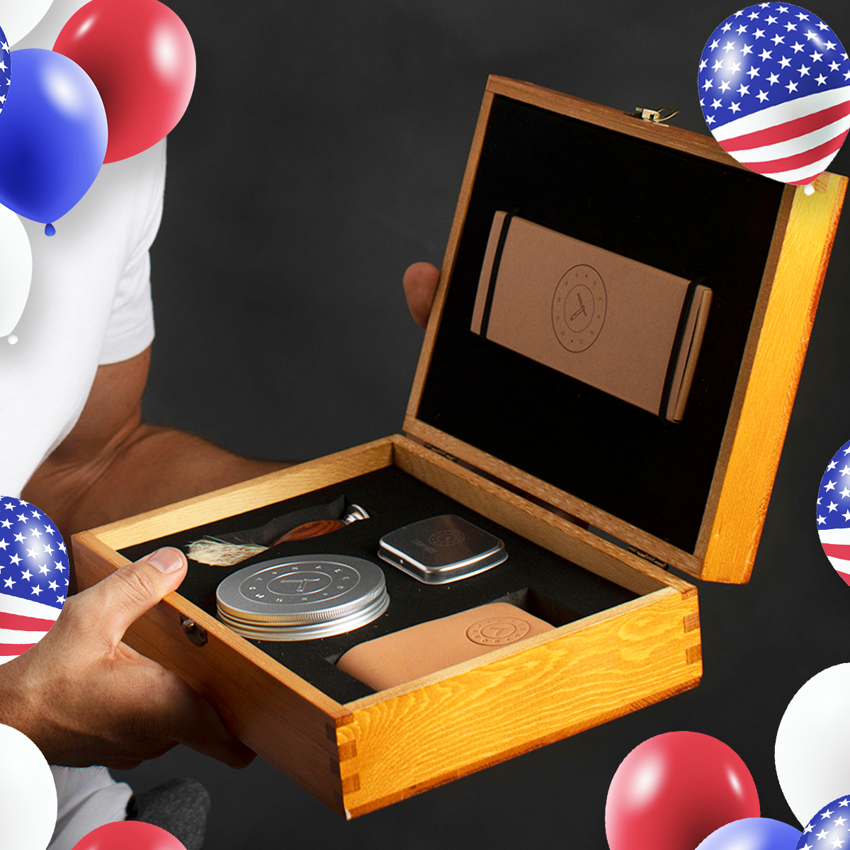 A man holding open the premium wooden Naked Armor Solomon Straight Razor Kit containing a straight razor, leather strop, shaving soap, shaving brush, and strop paste.