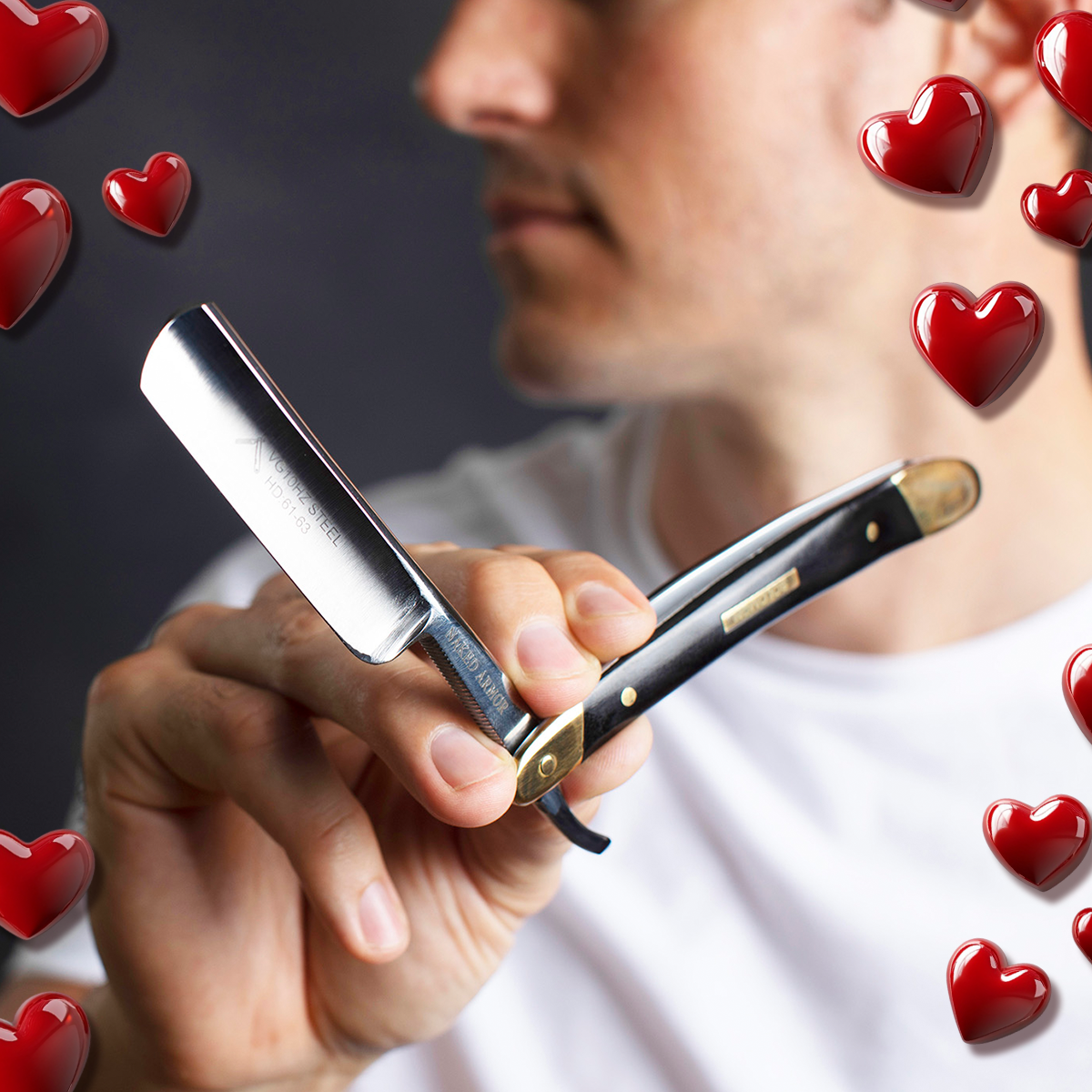 Man holding the Naked Armor Solomon Straight Razor (Black) for Valentine's Day